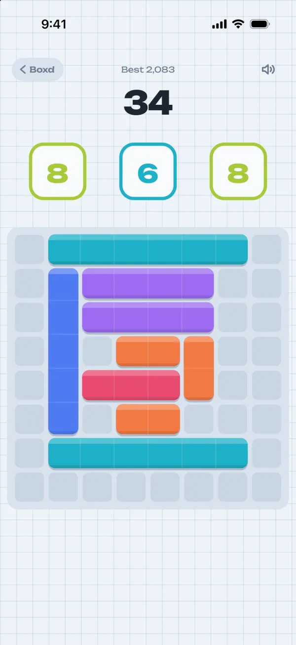 Boxd: three numbers wait above the board, with coloured rectangles already placed on it.